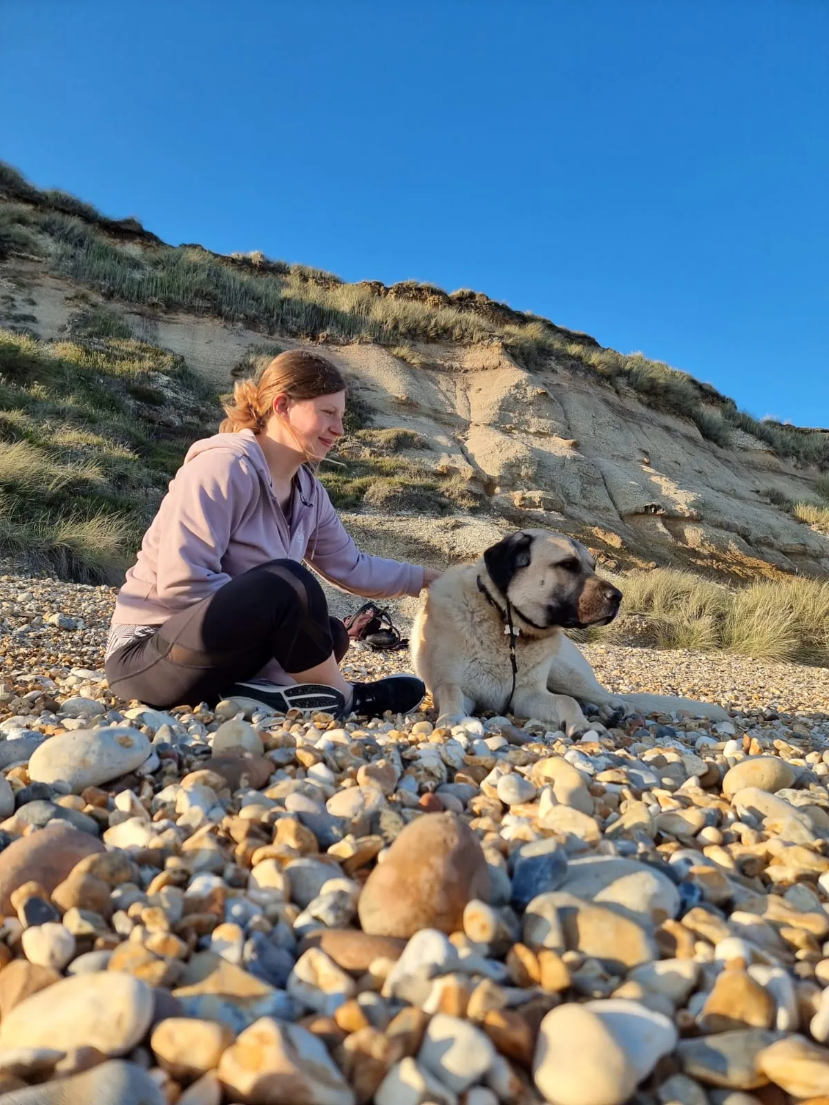 Monika and Aslan walking together at Hengistbury Head